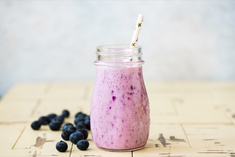 blended blueberry smoothie in glass